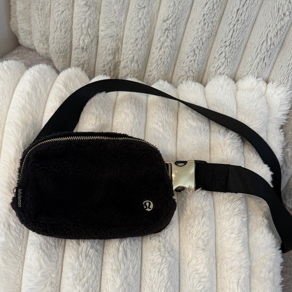 lululemon black fuzzy belt bag with gold zipper